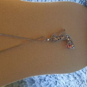 Shoe necklace comes with studded earrings